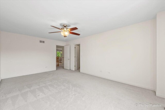 405 Lela Ln, Bartlett, IL 60103 - empty room with ceiling fan, light carpet, and baseboards