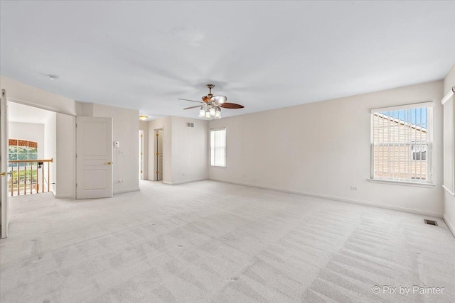 405 Lela Ln, Bartlett, IL 60103 - spare room with ceiling fan, light carpet, and baseboards
