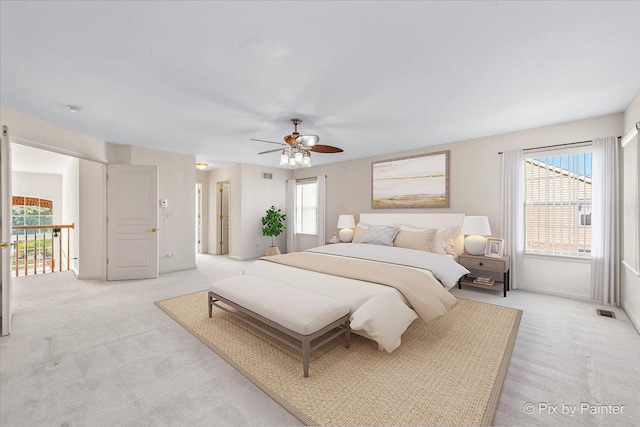 405 Lela Ln, Bartlett, IL 60103 - bedroom featuring light colored carpet, a ceiling fan, and baseboards