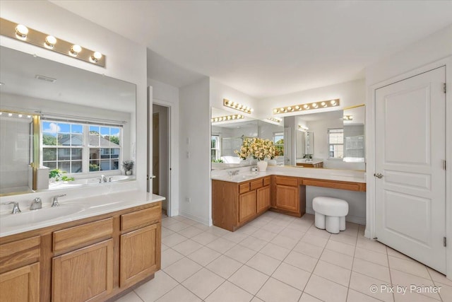 405 Lela Ln, Bartlett, IL 60103 - full bathroom with tile patterned floors, vanity, and a bath