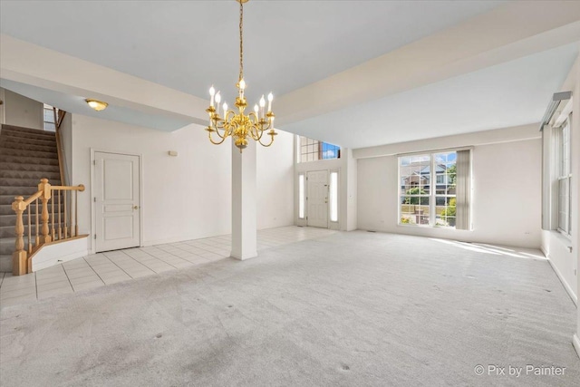 405 Lela Ln, Bartlett, IL 60103 - unfurnished living room featuring carpet floors, stairway, a chandelier, and tile patterned flooring