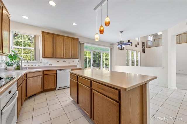 405 Lela Ln, Bartlett, IL 60103 - kitchen featuring white appliances, light tile patterned floors, healthy amount of natural light, and recessed lighting