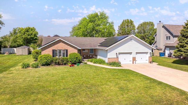 2588 Big Bluestem Rd, Morris, IL 60450 - single story home with brick siding, roof mounted solar panels, a front yard, an attached garage, and driveway