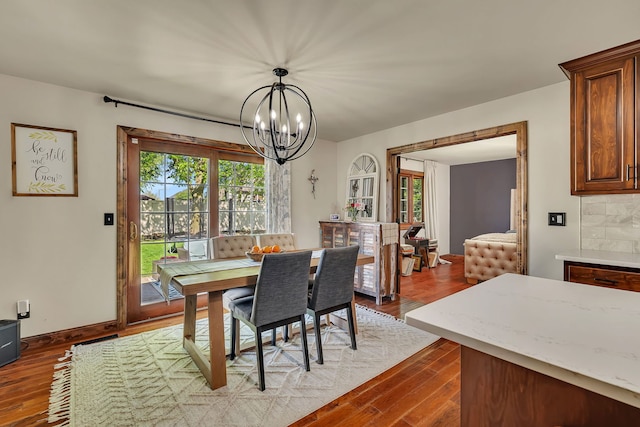 2588 Big Bluestem Rd, Morris, IL 60450 - dining room featuring wood finished floors, plenty of natural light, and a chandelier