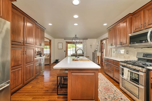 2588 Big Bluestem Rd, Morris, IL 60450 - kitchen featuring appliances with stainless steel finishes, a sink, recessed lighting, a center island with sink, and tasteful backsplash