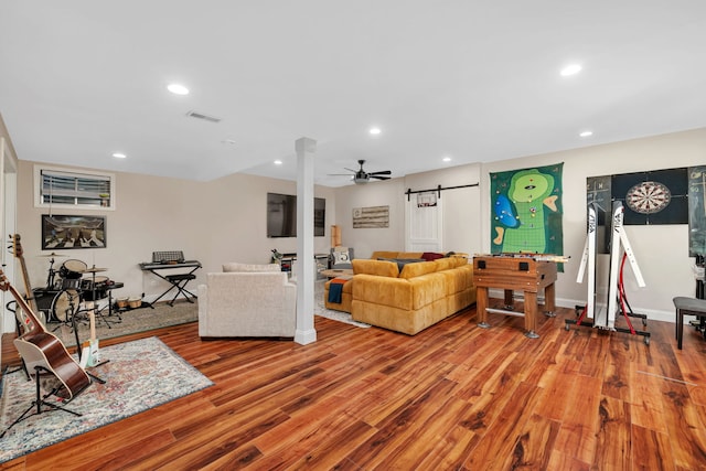 2588 Big Bluestem Rd, Morris, IL 60450 - living area featuring wood finished floors, recessed lighting, ceiling fan, ornate columns, and a barn door