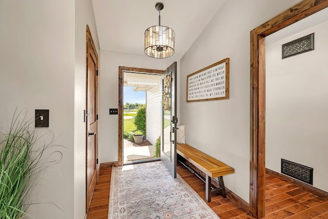 2588 Big Bluestem Rd, Morris, IL 60450 - doorway featuring wood finished floors, a chandelier, and baseboards