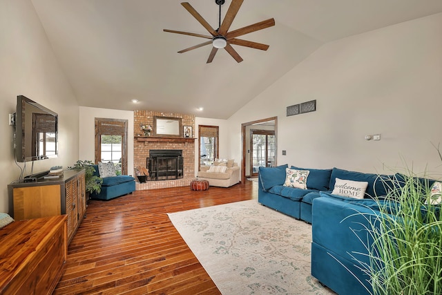 2588 Big Bluestem Rd, Morris, IL 60450 - living room with a ceiling fan, dark wood-style flooring, high vaulted ceiling, and a fireplace