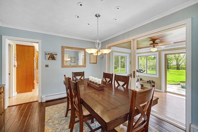 dining area with a baseboard radiator, crown molding, dark wood finished floors, a chandelier, and baseboards