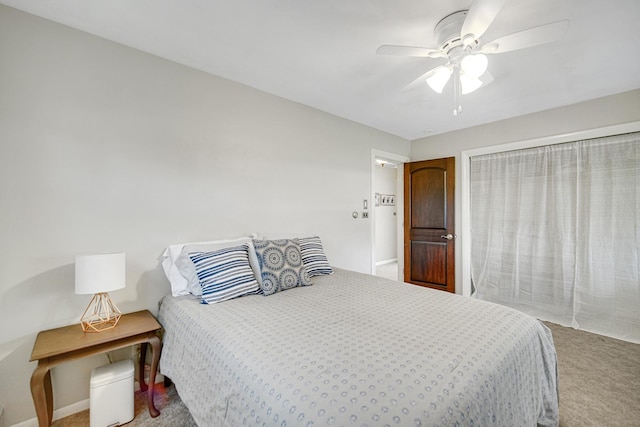 carpeted bedroom featuring a ceiling fan and baseboards
