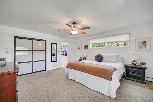 bedroom featuring carpet, ceiling fan, and connected bathroom