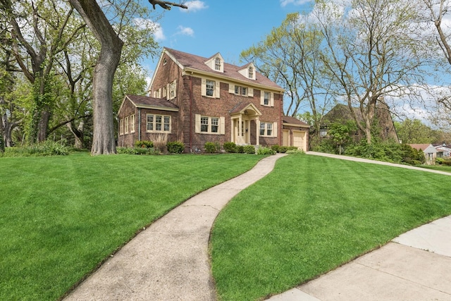 2141 Evans Rd, Flossmoor, IL 60422 - colonial home with brick siding, a front yard, a garage, and driveway