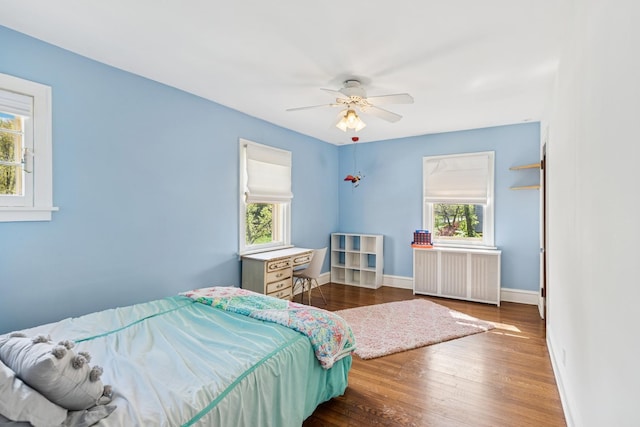 2141 Evans Rd, Flossmoor, IL 60422 - bedroom with radiator, wood finished floors, baseboards, and ceiling fan