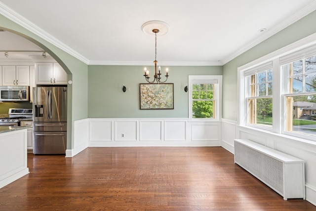 2141 Evans Rd, Flossmoor, IL 60422 - unfurnished dining area featuring radiator heating unit, arched walkways, a chandelier, dark wood-type flooring, and crown molding