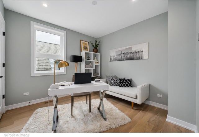 office space featuring wood finished floors, baseboards, and recessed lighting