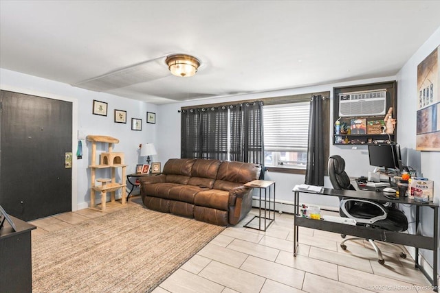 living room featuring a desk, a wall mounted AC, and baseboard heating