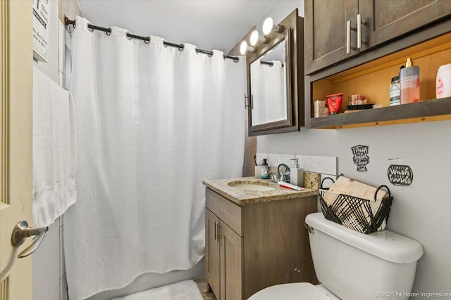 full bath with toilet, vanity, and shower / bathtub combination with curtain