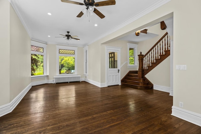 827 Madison St, Evanston, IL 60202 - unfurnished living room featuring radiator heating unit, healthy amount of natural light, wood finished floors, stairs, and ornamental molding