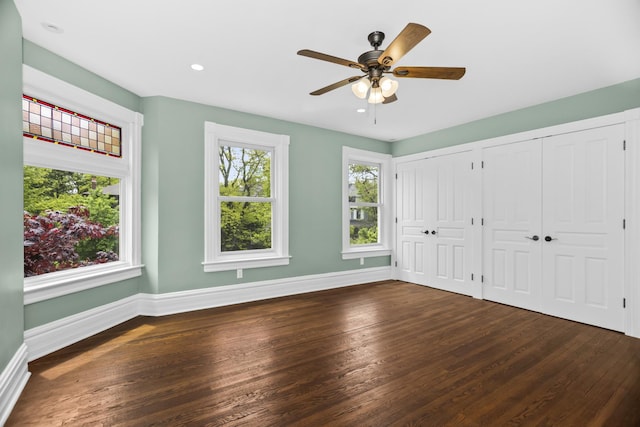 827 Madison St, Evanston, IL 60202 - unfurnished bedroom featuring two closets, baseboards, dark wood-style flooring, recessed lighting, and a ceiling fan