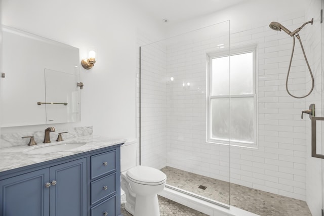 827 Madison St, Evanston, IL 60202 - full bathroom with a tile shower, vanity, and toilet