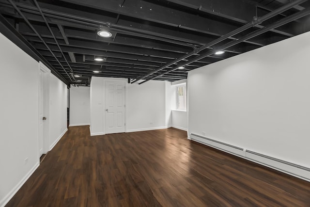 827 Madison St, Evanston, IL 60202 - basement with baseboard heating, wood finished floors, and baseboards