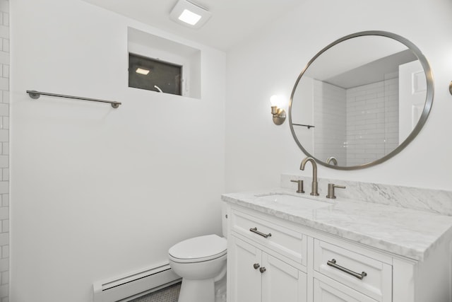 827 Madison St, Evanston, IL 60202 - bathroom with baseboard heating, vanity, and toilet