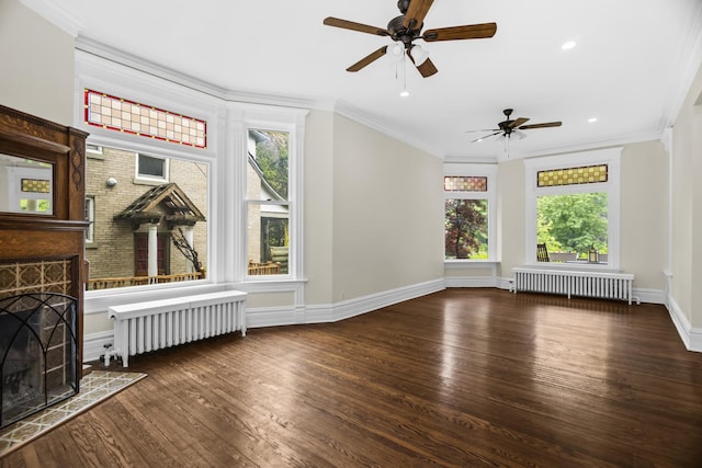 827 Madison St, Evanston, IL 60202 - unfurnished living room featuring radiator, wood finished floors, healthy amount of natural light, ornamental molding, and recessed lighting