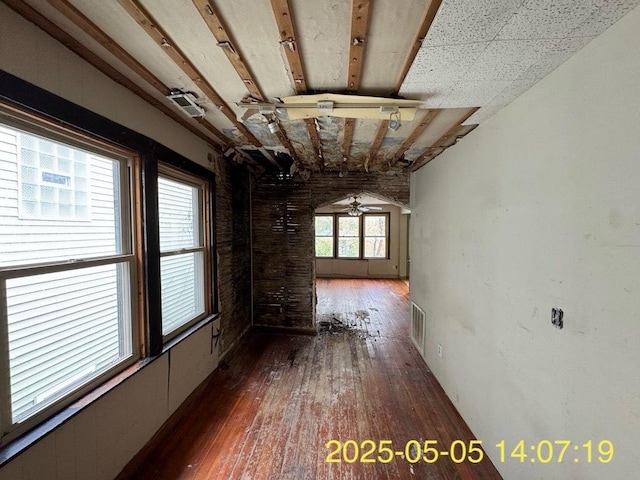 hall with visible vents and hardwood / wood-style flooring