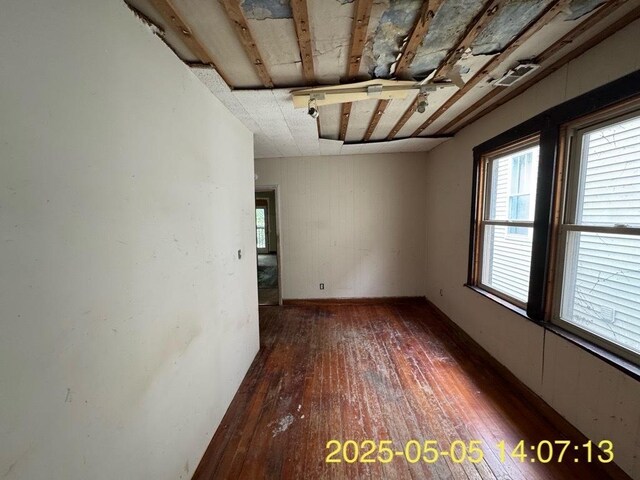 empty room featuring wood-type flooring