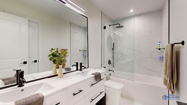 bathroom featuring toilet, shower / washtub combination, double vanity, and recessed lighting