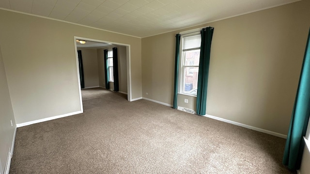 306 S Liberty St, Elgin, IL 60120 - unfurnished room with crown molding, carpet floors, and baseboards