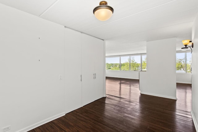 2020 St Johns Ave Unit 507, Highland Park, IL 60035 - unfurnished room featuring wood finished floors and baseboards