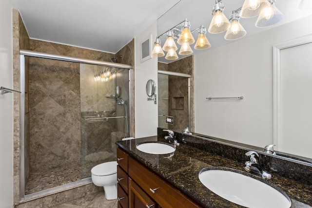 2020 St Johns Ave Unit 507, Highland Park, IL 60035 - bathroom with double vanity, a stall shower, toilet, and tile patterned floors