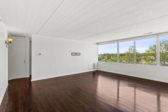 2020 St Johns Ave Unit 507, Highland Park, IL 60035 - spare room with wood finished floors and baseboards