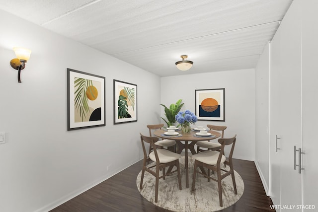 2020 St Johns Ave Unit 507, Highland Park, IL 60035 - dining area with dark wood-style floors and baseboards