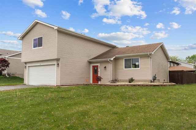view of front of property with a garage and asphalt driveway
