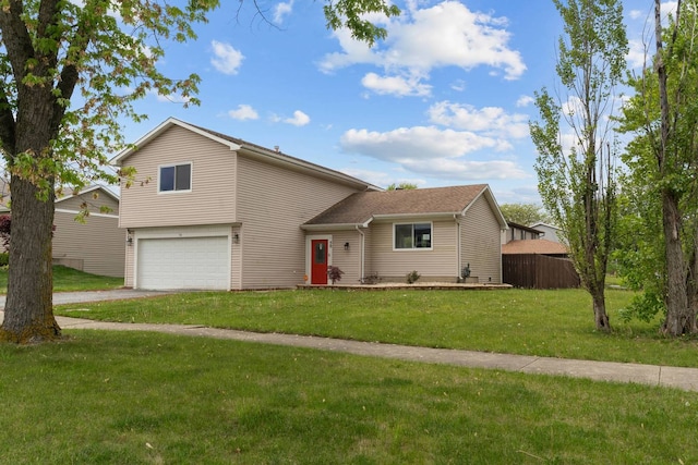 view of front of house featuring a garage and asphalt driveway
