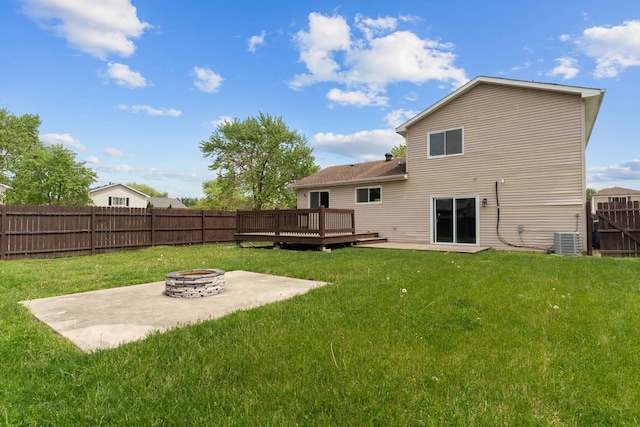 back of house featuring an outdoor fire pit, a wooden deck, central AC, and a patio area