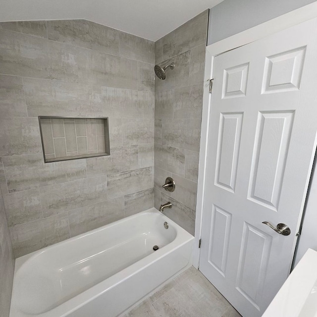 bathroom featuring washtub / shower combination