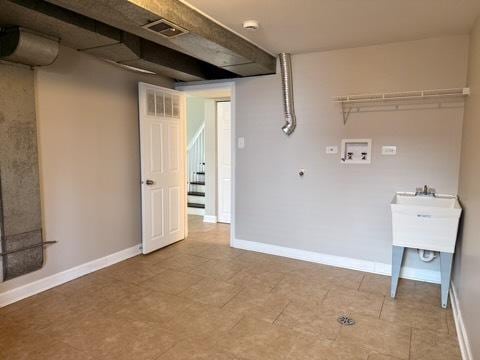 washroom featuring hookup for a washing machine and baseboards