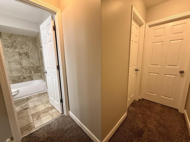 hallway with carpet flooring