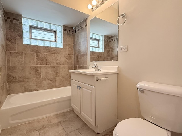 full bath with toilet, bathtub / shower combination, tile patterned flooring, and vanity