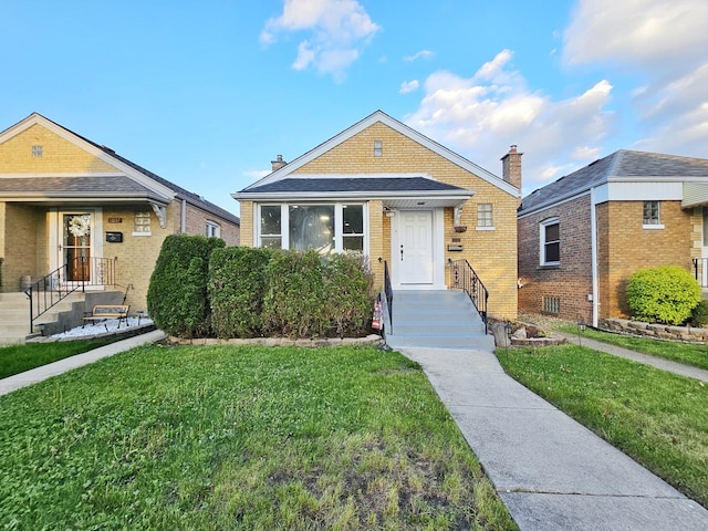6041 S Mcvicker Ave, Chicago, IL 60638 - view of front of property with brick siding and a front lawn