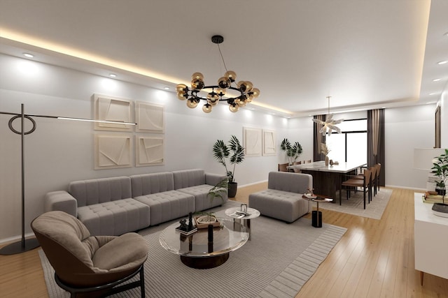 living area with a chandelier, light wood-style flooring, and baseboards