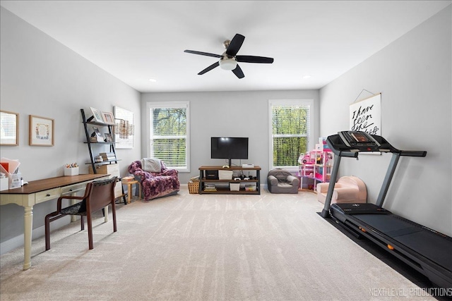 workout area with carpet flooring, healthy amount of natural light, and a ceiling fan