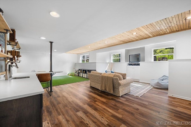 living room with dark wood-type flooring and recessed lighting