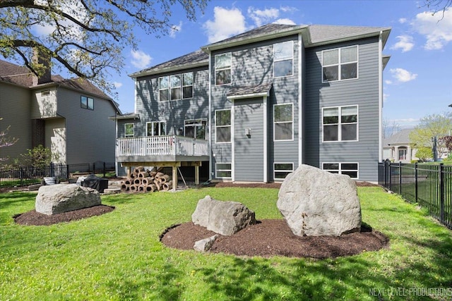 back of house featuring a wooden deck