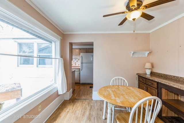 15508 Lavergne Ave, Oak Forest, IL 60452 - dining space featuring light wood finished floors, crown molding, and a ceiling fan