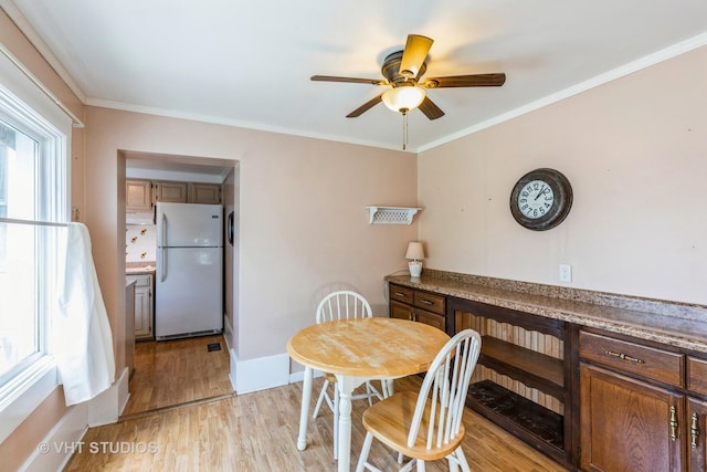 15508 Lavergne Ave, Oak Forest, IL 60452 - dining area with a ceiling fan, light wood-type flooring, plenty of natural light, and crown molding