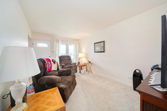 living room with carpet flooring and baseboards
